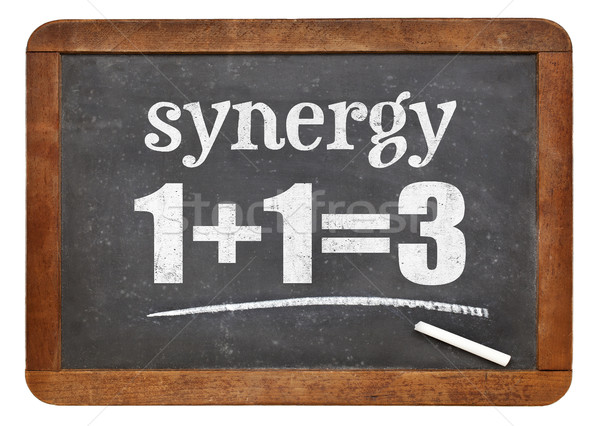synergy concept on blackboard Stock photo © PixelsAway