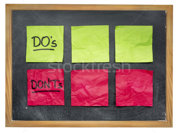 dos and donts on blackboard Stock photo © PixelsAway
