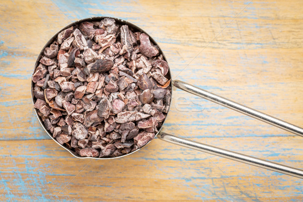 raw cacao nibs in metal scoop Stock photo © PixelsAway