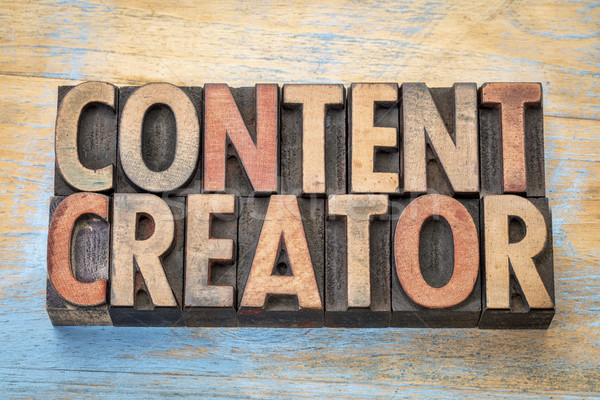 content creator  words in wood type Stock photo © PixelsAway