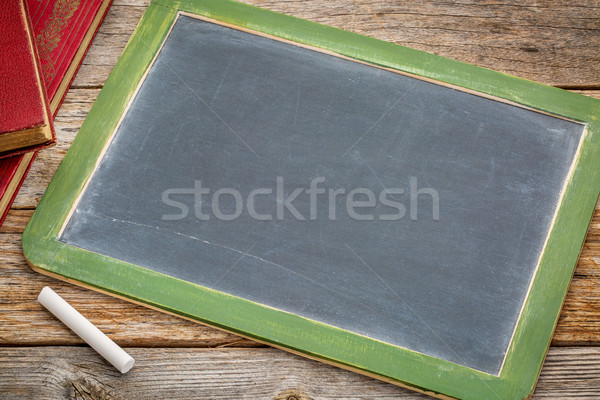 blank slate blackboard with chalk and books Stock photo © PixelsAway