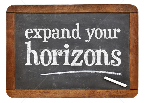 Stock photo: Expand your horizons blackboard sign