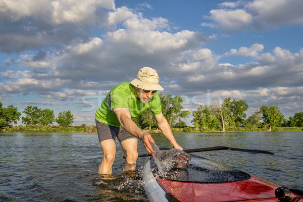 male SUP paddler with paddleboard Stock photo © PixelsAway