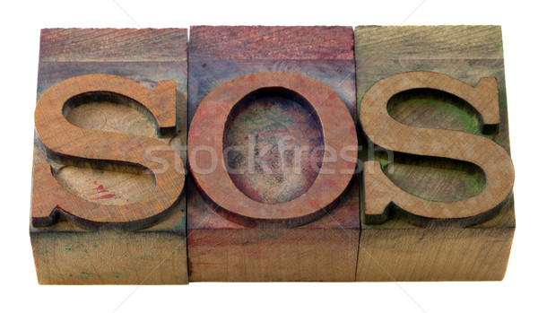 sos sign in letterpress type Stock photo © PixelsAway