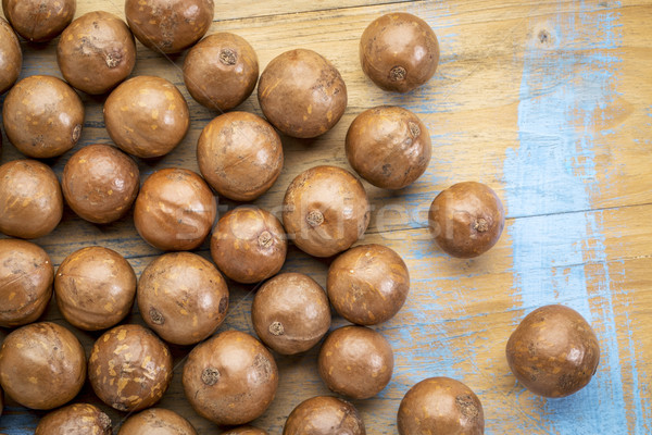 macadamia nuts on rustic wood Stock photo © PixelsAway