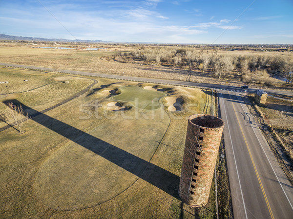 farm silo and golf course Stock photo © PixelsAway