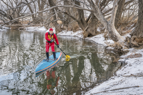 winter stand up paddling Stock photo © PixelsAway
