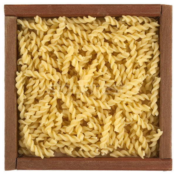 uncooked fusilli pasta in wooden box Stock photo © PixelsAway