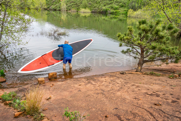 senior paddler launching  SUP paddleboard Stock photo © PixelsAway