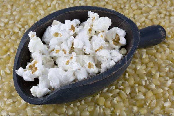 wooden scoop of popcorn and corn kernels Stock photo © PixelsAway