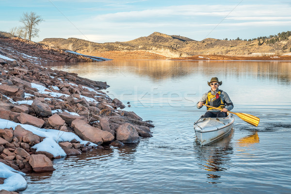 winter canoe paddling in Colorado Stock photo © PixelsAway