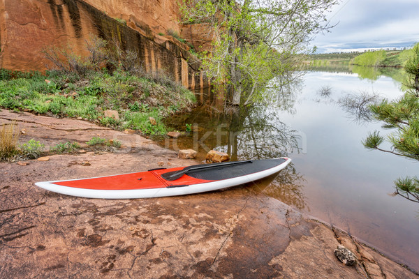 stand up paddleborad on lake shore Stock photo © PixelsAway