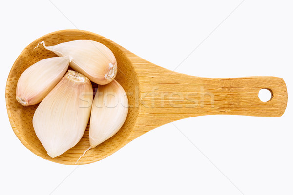 Ajo clavos cuchara de madera pequeño aislado blanco Foto stock © PixelsAway
