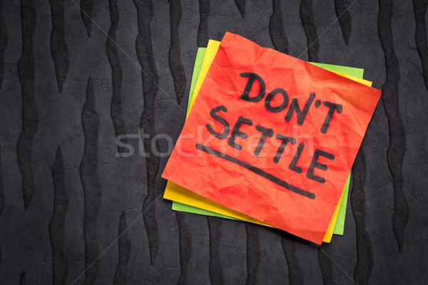 Do not settle reminder on sticky note Stock photo © PixelsAway