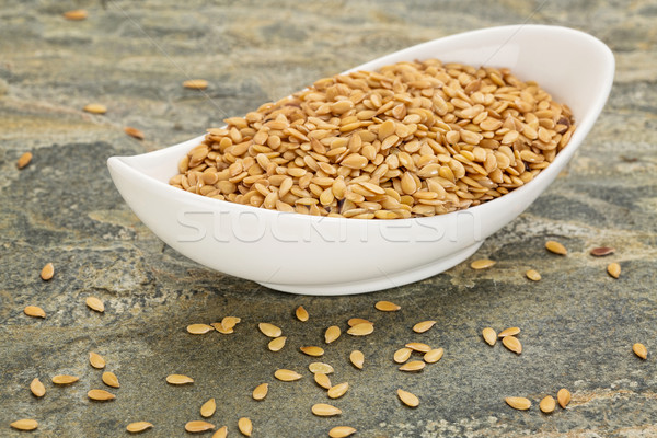 bowl of gold flax seeds Stock photo © PixelsAway