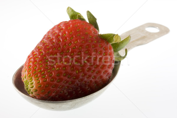 strawberry on measuring tablespoon Stock photo © PixelsAway