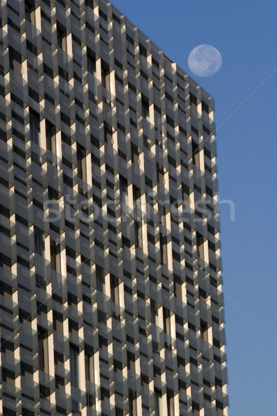 facade of modern hotel building against a blues sky with the moo Stock photo © PixelsAway