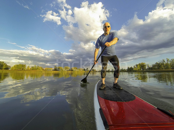 stand up paddling Stock photo © PixelsAway