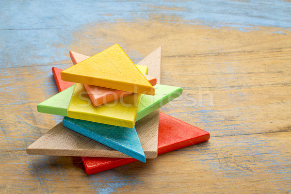 pieces of wooden tangram puzzle Stock photo © PixelsAway