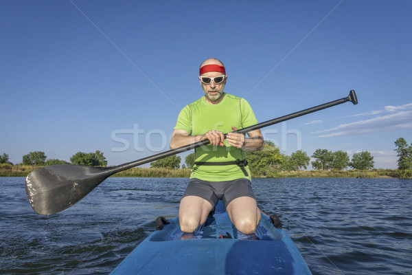 senior male paddler on paddleboard Stock photo © PixelsAway