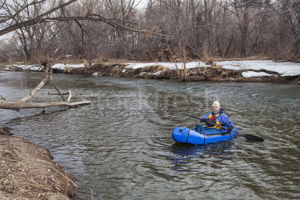Stock photo: paddling a packraft on a river
