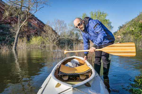 senior paddler and expedition canoe Stock photo © PixelsAway