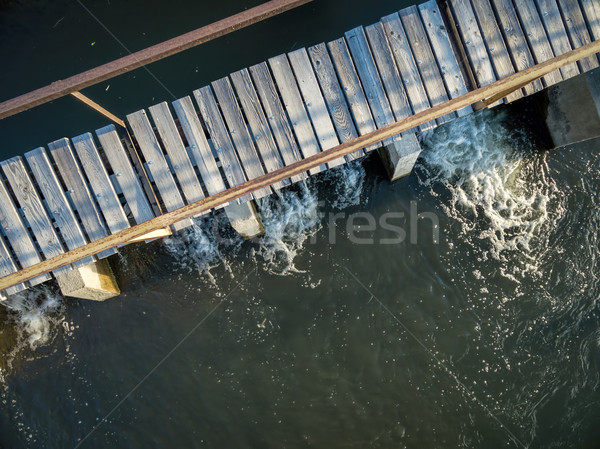river diversion dam with foothbridge Stock photo © PixelsAway
