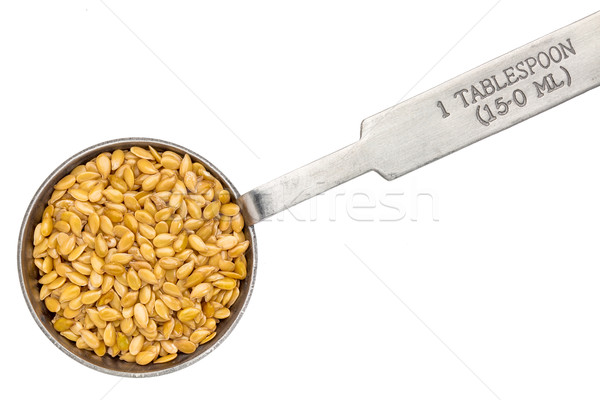 golden flax seed on measuring spoon Stock photo © PixelsAway