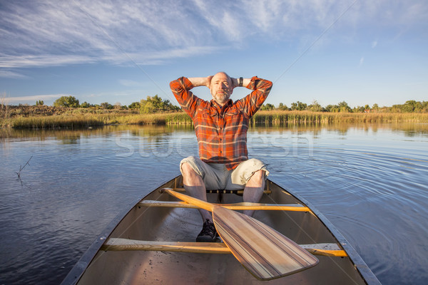 enjoying evening canoe paddling Stock photo © PixelsAway