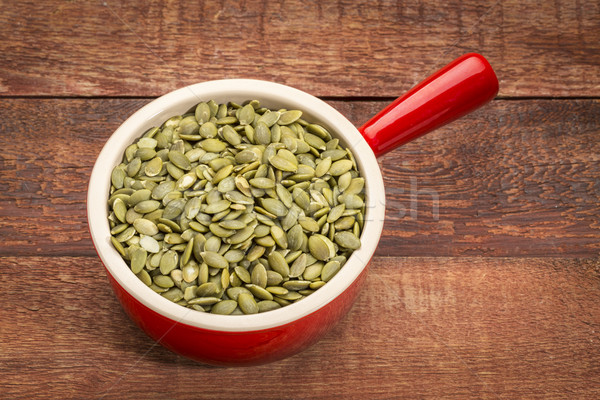 pumpkin seeds in a stoneware cup Stock photo © PixelsAway