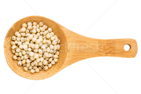 sorghum grain on wooden spoon Stock photo © PixelsAway