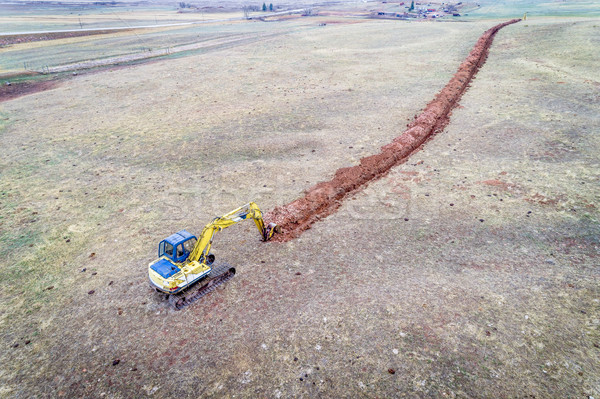 backhoe excavator digging a ditch  Stock photo © PixelsAway