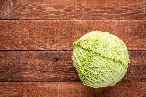 savoy cabbage on rustic wood Stock photo © PixelsAway