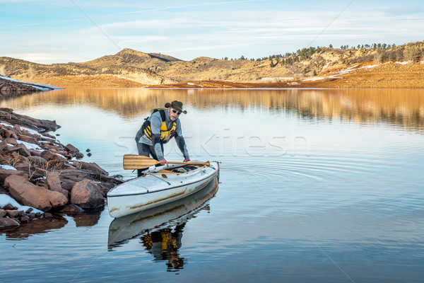 winter canoe paddling in Colorado Stock photo © PixelsAway