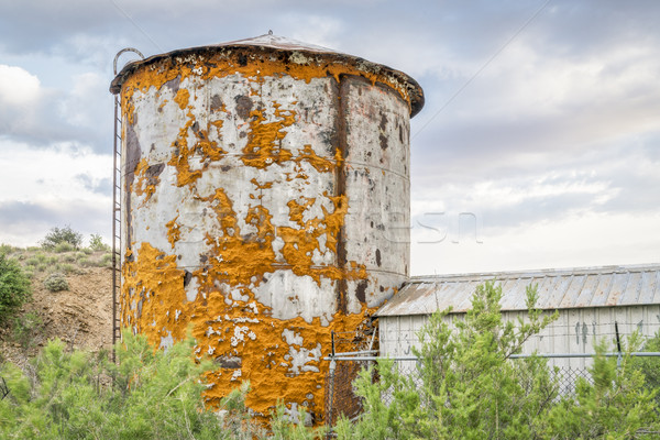 old water tank covered by lichen Stock photo © PixelsAway