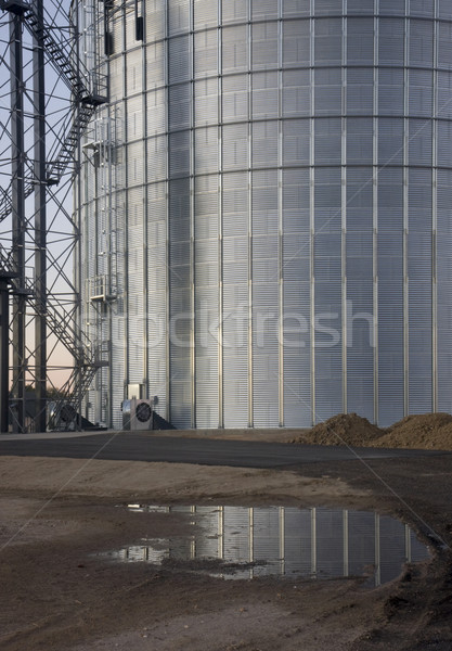 newly constructed metal grain silo with water reflection Stock photo © PixelsAway