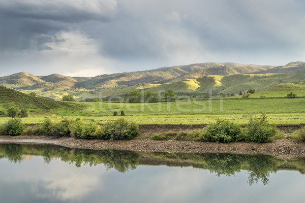 lake and green meadows at  foothills Stock photo © PixelsAway
