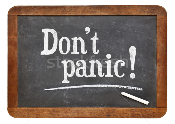 Do not panic - text on blackboard Stock photo © PixelsAway