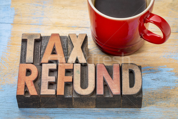 tax refund in wood type Stock photo © PixelsAway