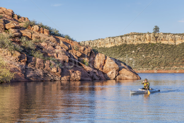 canoe paddling on a lake Stock photo © PixelsAway