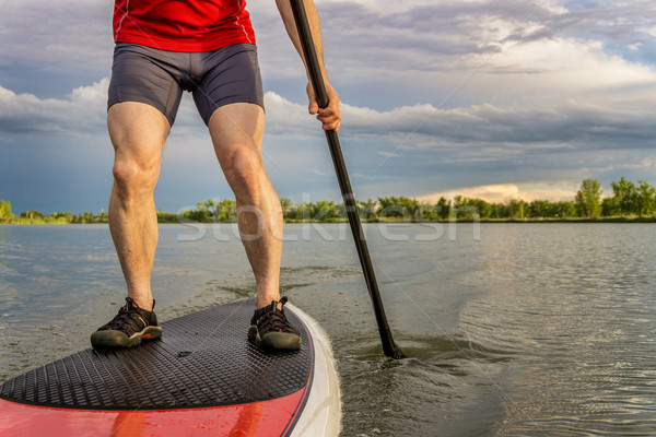 stand up paddling on lake Stock photo © PixelsAway