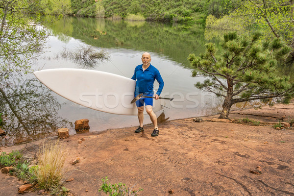 senior paddler with SUP paddleboard Stock photo © PixelsAway