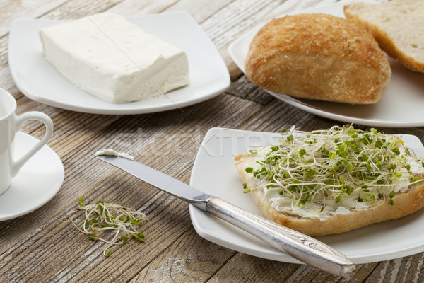 Stock photo: roll with cream cheese and sprouts