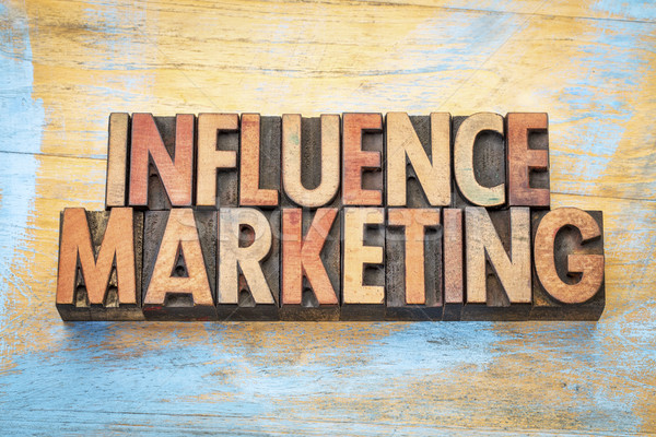 Stock photo: influence marketing in wood type