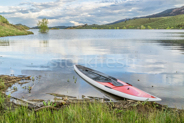 red SUP paddleboard on lake shore Stock photo © PixelsAway
