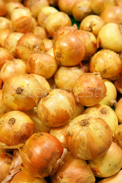 Pile of Yellow Onions with Their Skins in a Grocery Store Stock photo © pixelsnap
