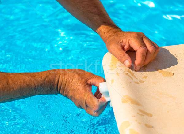 Clean the water line of a pool Stock photo © pixinoo