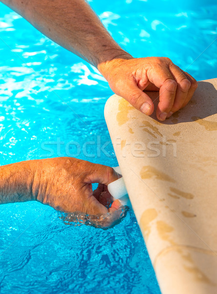 Clean the water line of a pool Stock photo © pixinoo