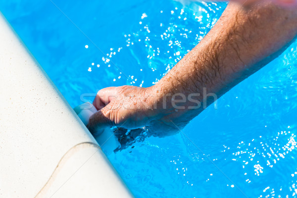 Clean the water line of a pool Stock photo © pixinoo
