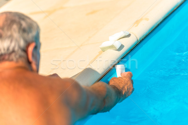 Clean the water line of a pool Stock photo © pixinoo
